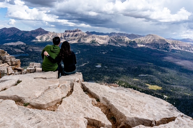 man and woman overlooking uinta mountains in utah